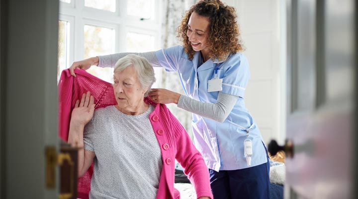 Woman assisting dressing